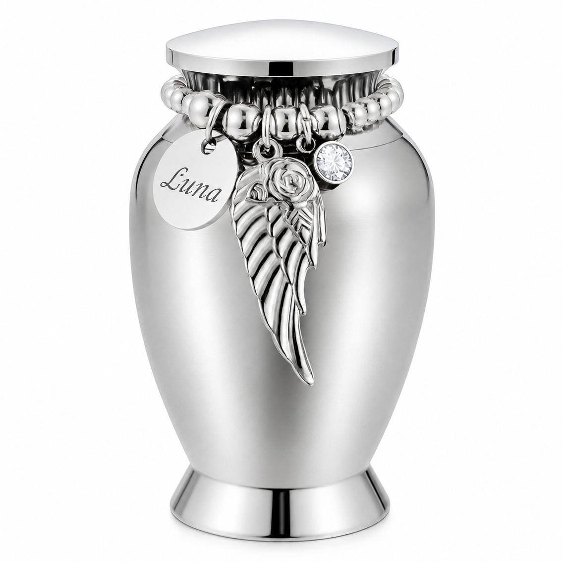 De laatste aai zilverkleurige RVS mini urn met gepersonaliseerd naamplaatje, engelenvleugel en kristallen bedel.
